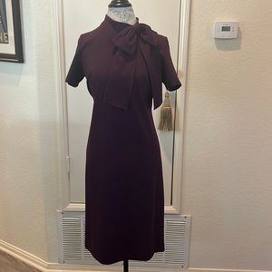 Plum purple sheath dress with bow detail
